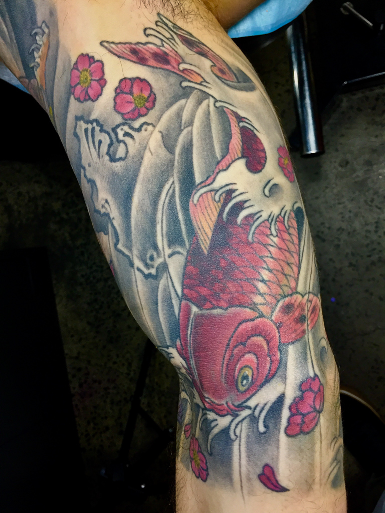 Koi fish half sleeve tattoo