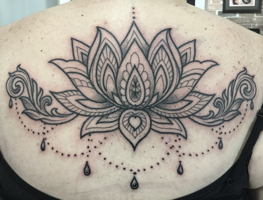 Lotus flower dangling jewellery tattoo