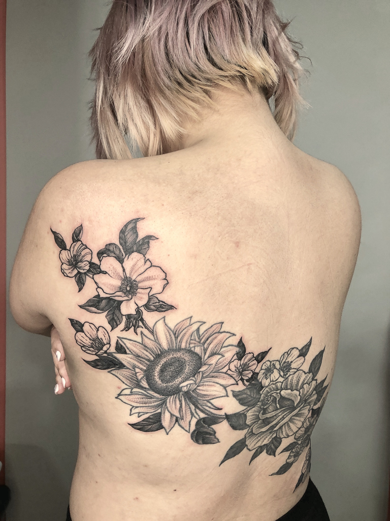 amazing flowers female tattoo