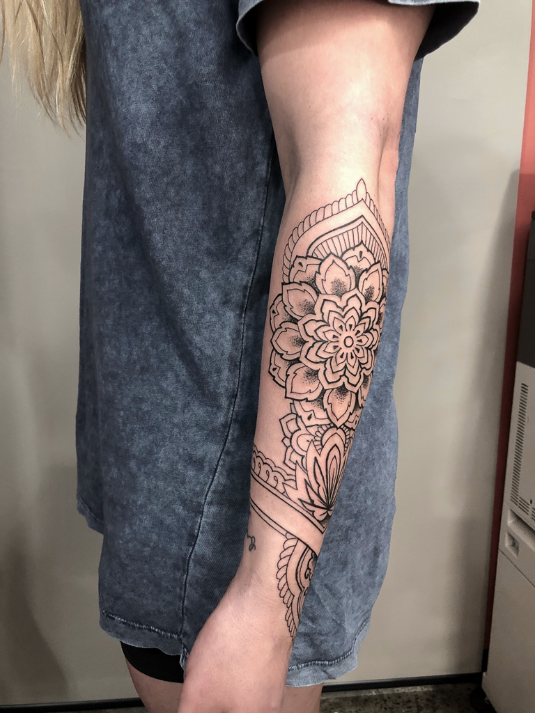 beautiful forearm mandala female tattoo