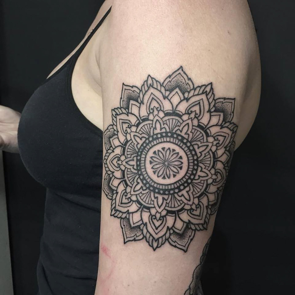 intricate mandala arm tattoo