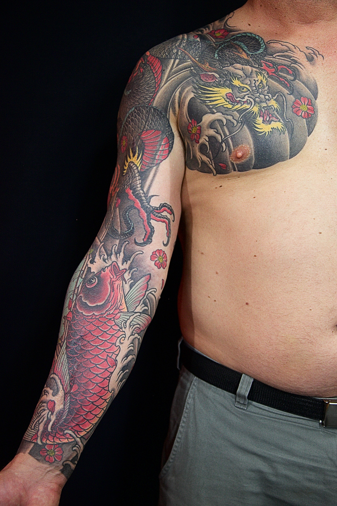 koi fish and dragon full sleeve and chest tattoo.