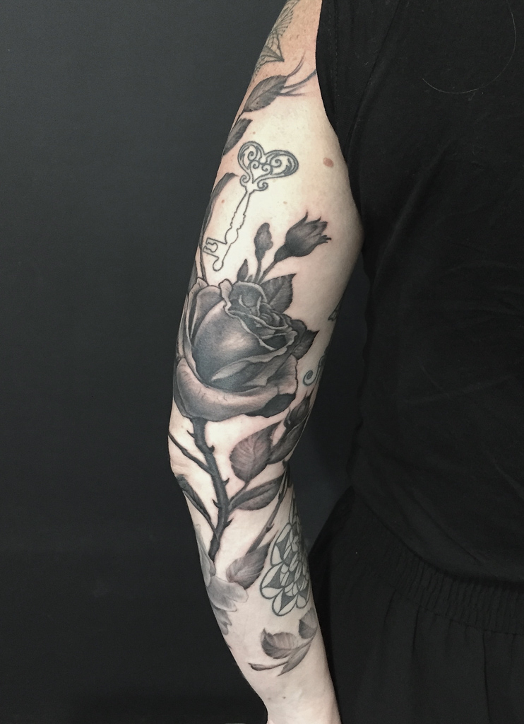 realistic rose arm tattoo