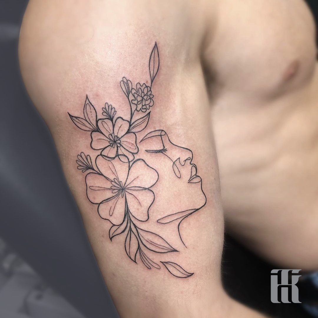 marcella ink tattoo minimalist face flowers arm